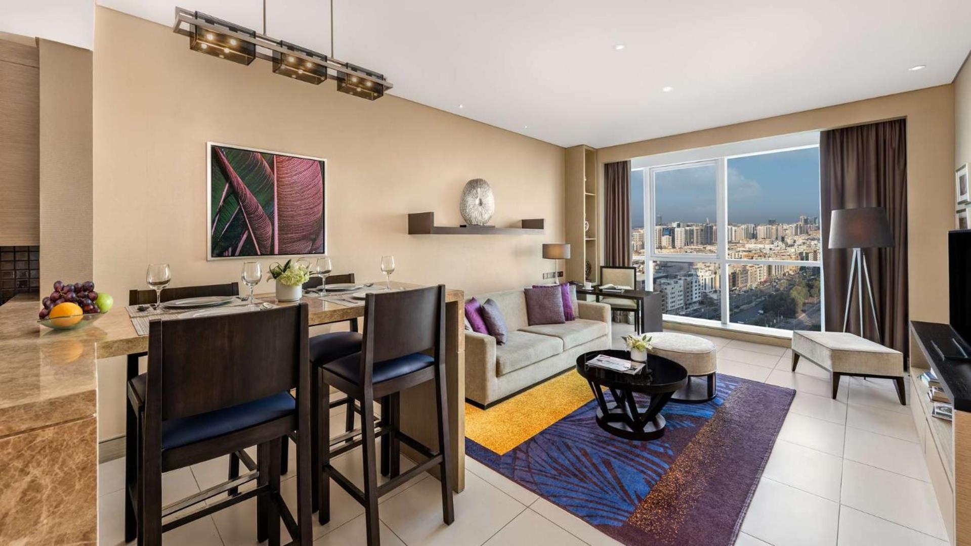 Dusit Thani Абу-Даби Экстерьер фото A living room at the Ritz-Carlton, Downtown, Dubai